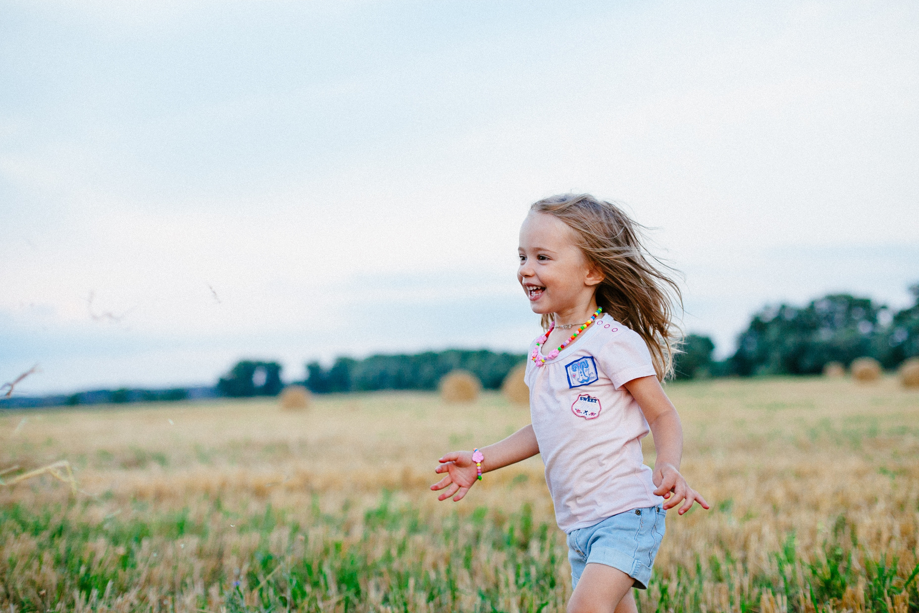 Happy Child Playing in the Field